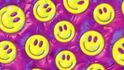 Repeating yellow smiley faces with a glossy finish on a vibrant pink background. Stock Footage 277529392