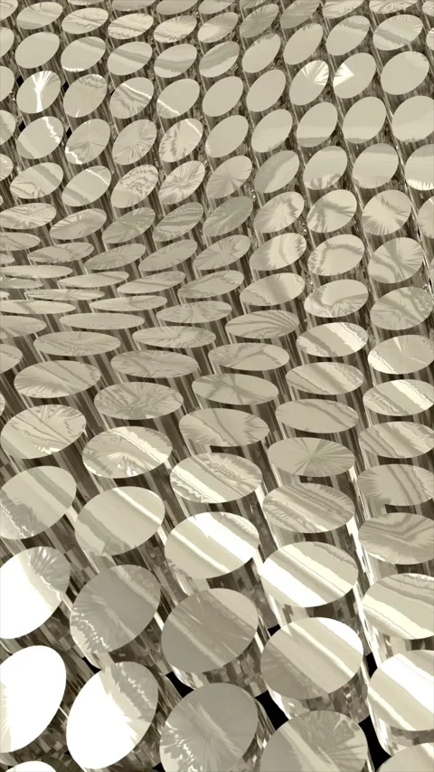 Repetitive array of metallic, textured discs creating a futuristic surface .. 库存影片 313926420