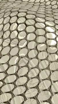 Repetitive array of metallic, textured discs creating a futuristic surface pa Stock Photos