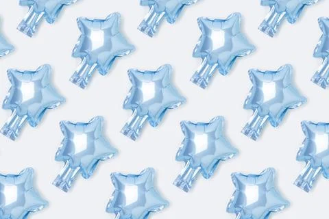 Repetitive pattern made from blue star foil balloon. Stock Photos