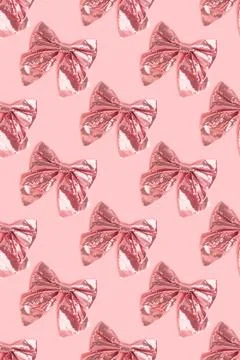Repetitive pattern made of bows with sequins. Stock Photos