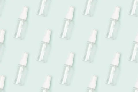 Repetitive pattern made of empty transparent spray bottle. Stock Photos