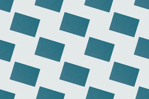 Repetitive pattern made of green envelopes. Stock Photos