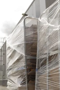 Repetitive stacking of pallets creates rhythmic visual in industrial space Stock Photos