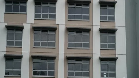 Repetitive Window Pattern on a Contemporary Apartment Building Stock Photos