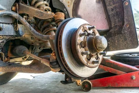 Replace brake disc and pads Front Disk brake assembly on an old car - Brake j Stock Photos