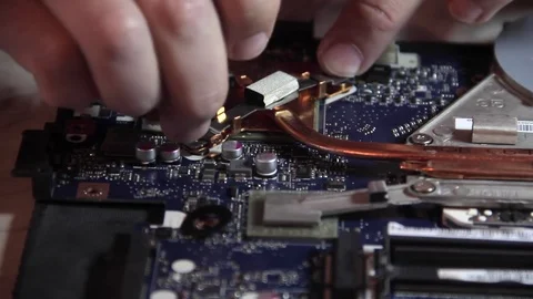 Replace the cooler on the motherboard Stock Footage 71507825