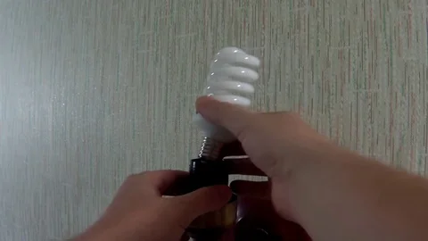 Replace the lamp in the luminaire Stock Footage 70987673