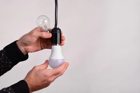 Replace the light bulb with an LED one. Stock Photos