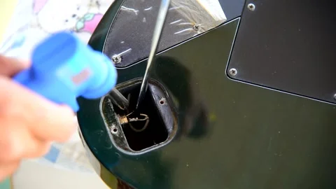 Replace the New Guitar Socket Jack to old guitar Stock Footage 275159484