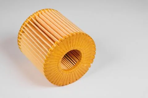Replaceable cartridge fuel system. New fuel filter element on a gray gradient 스톡 사진