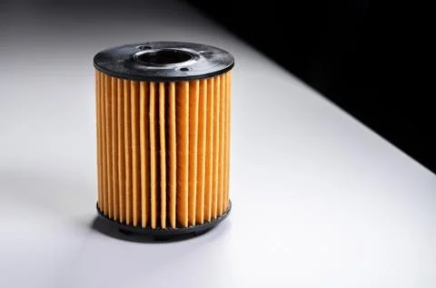 Replaceable cartridge fuel system. New fuel filter element on a gray gradient Stock Photos