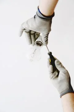 Replacement and installation of an  light bulb Stock Photos