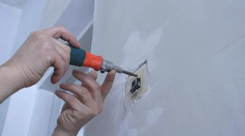 Replacement of an antique switch when updating an interior Stock Photos