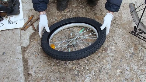 Replacement of bber on the Bicycle wheel. Stock Footage 108452895