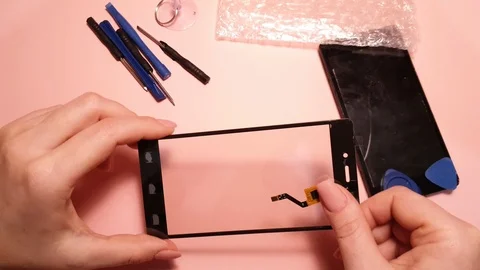 Replacement of broken smartphone screen, cell phone repair Stock Footage 120627220