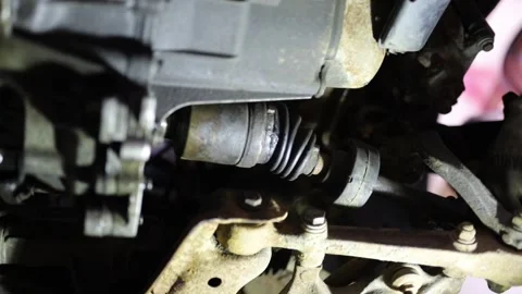 Replacement of the drive axle and CV joint Stock Footage 305931548