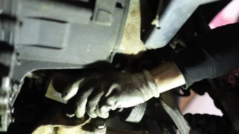 Replacement of the drive axle and CV joint Stock Footage 305931570