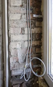 Replacement of the electrical cable in the old apartment Stock Photos