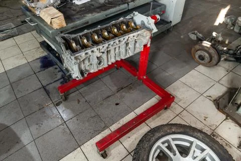 Replacement engine used on a crane mounted for installation on a car after a  Stock Photos