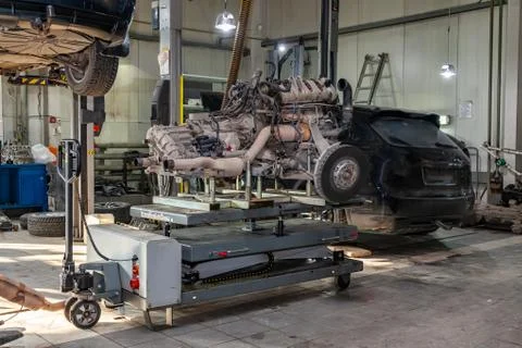 Replacement engine used on a table mounted for installation on a car after a  Stock Photos
