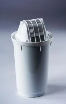 Replacement filter cartridge to purify drinking water. For a jug of drinking Stock Photos