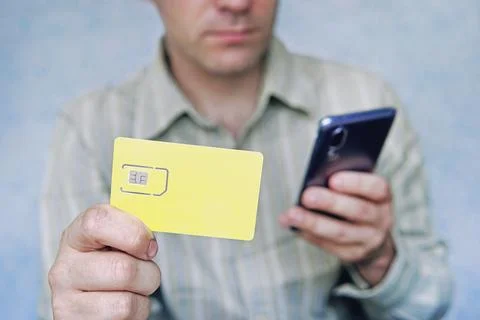 Replacement of nano sim card chip in modern smartphone, Close-up view. copy.. Stock Photos