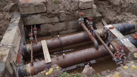Replacement of old heating mains with new insulated pipes. Stock Footage 320530063