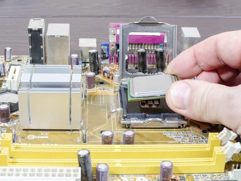 Replacement of the processor on the motherboard close-up Stock Photos
