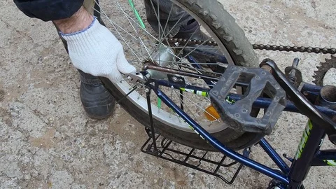 Replacement of rubber on the Bicycle wheel. Stock Footage 108452851