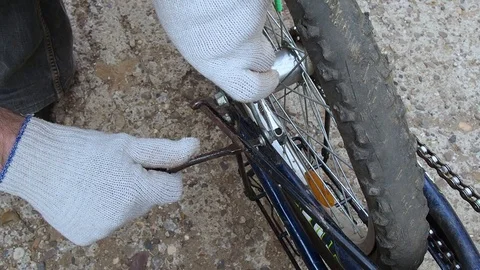 Replacement of rubber on the Bicycle wheel. Stock Footage 108452856