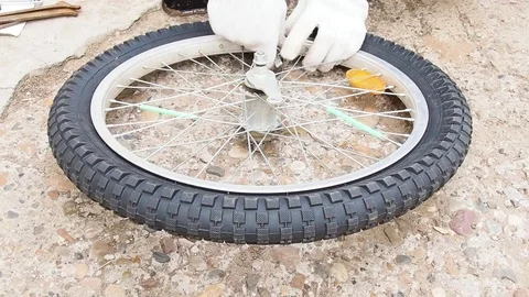 Replacement of rubber on the Bicycle wheel. Stock Footage 108452896