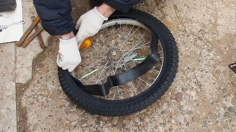Replacement of rubber on the Bicycle wheel. Stock Footage 108452897