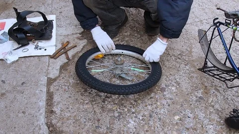 Replacement of rubber on the Bicycle wheel. Stock Footage 108452902