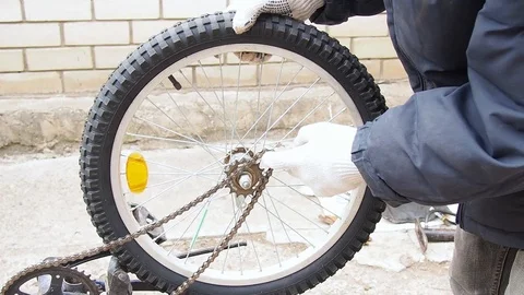 Replacement of rubber on the Bicycle wheel. Stock Footage 108452916