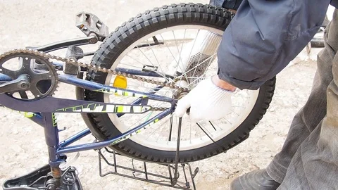 Replacement of rubber on the Bicycle wheel. Stock Footage 108452931