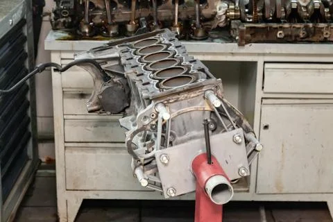 Replacement six cilinder engine used on a red crane mounted for installation  Stock Photos