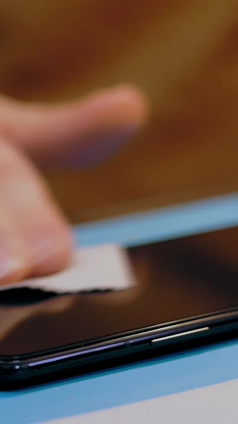 Replacement of smartphone screen protective glass. process of cleaning the Stock-Footage 323366681