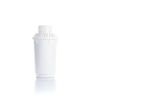 Replacement water filter on white background with reflection Fotos Stock