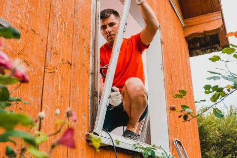 Replacement of a window and a window frame, dismantling of an old window in a Stock Photos