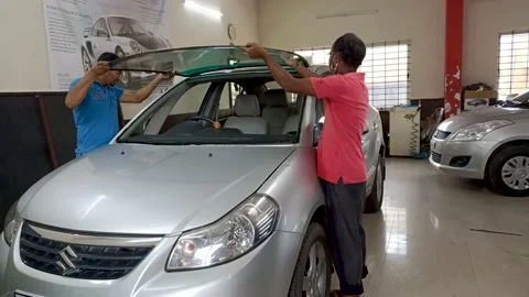 Replacement of a Windshield of a Motorcar in a Garage in Mysuru, India. Stock Footage 167144541