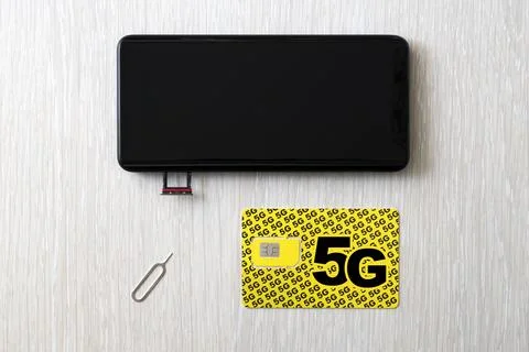 Replacing 4G SIM card with a high speed 5g SIM card close up on the store's.. 写真素材