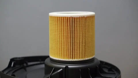 Replacing the air filter on a household vacuum cleaner. Close-up Video stock 290800962