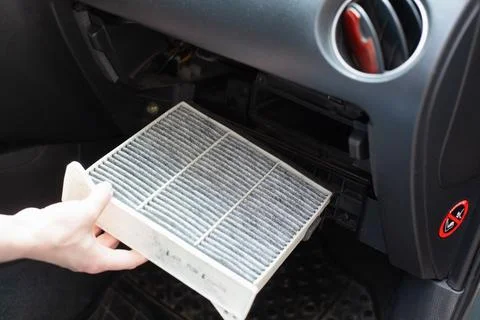 Replacing the ar cabin filter the car. Replacing New Air filter Stock Photos