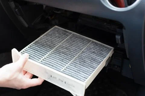 Replacing the ar cabin filter the car. Replacing New Air filter Stock Photos