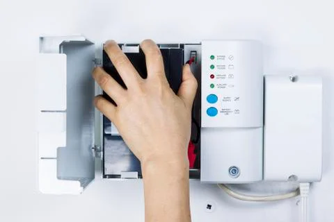 Replacing backup home system battery Stock Photos
