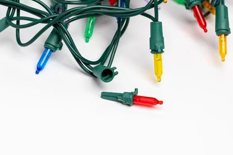 Replacing bad bulb in Christmas string lights. Stock Photos