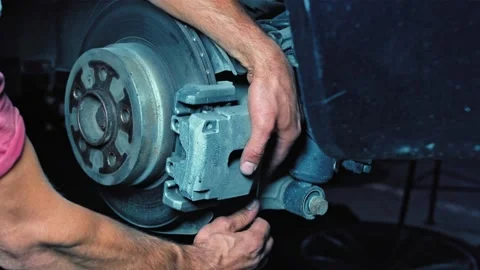 Replacing brake pads on a car at a workshop. Stock Footage 152296200