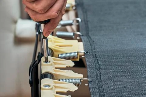 Replacing broken plastic bed slat holders 写真素材