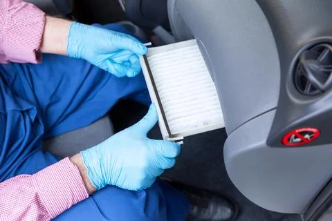 Replacing the cabin pollen air filter for a car Stock Photos